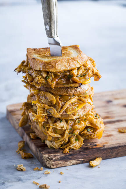Grilled chicken and cheese sandwiches with buffalo sauce — Stock Photo