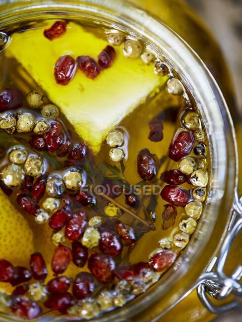 Pickled cheese in a glass jar — Stock Photo