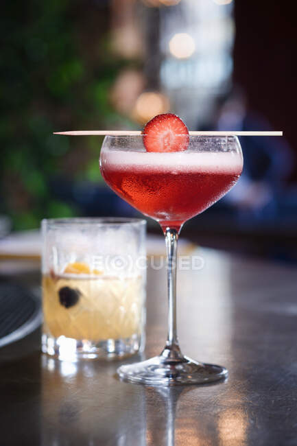 A champagne cocktail with strawberries — Stock Photo