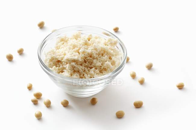 Bowl of tasty risotto with dried fruits on white background — Stock Photo