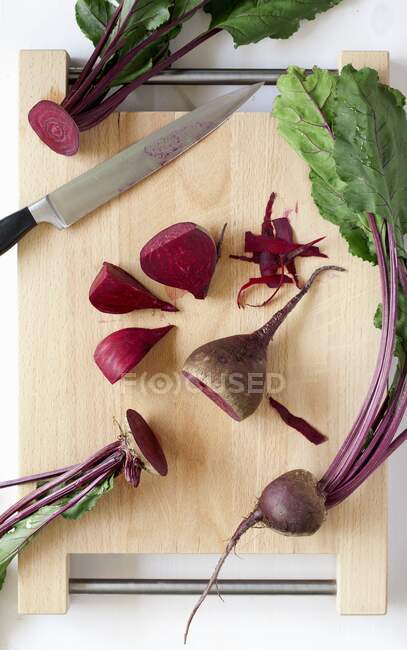 Fresh red and white radish on a wooden board — Stock Photo