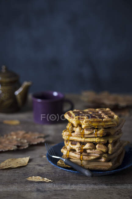 Pumpkin waffles with maple syrup — Stock Photo