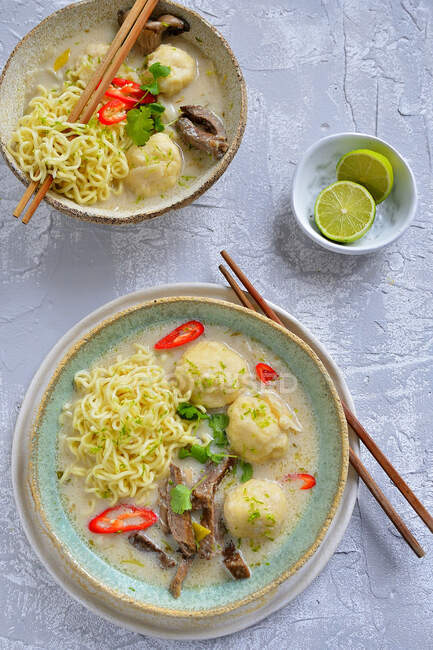 Thai soup with chow mein noodles fish pulp and chilli — Stock Photo