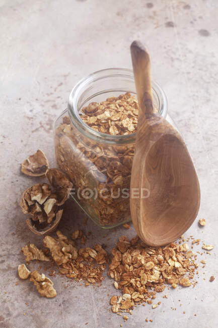 A jar of homemade roasted muesli with walnuts — Stock Photo