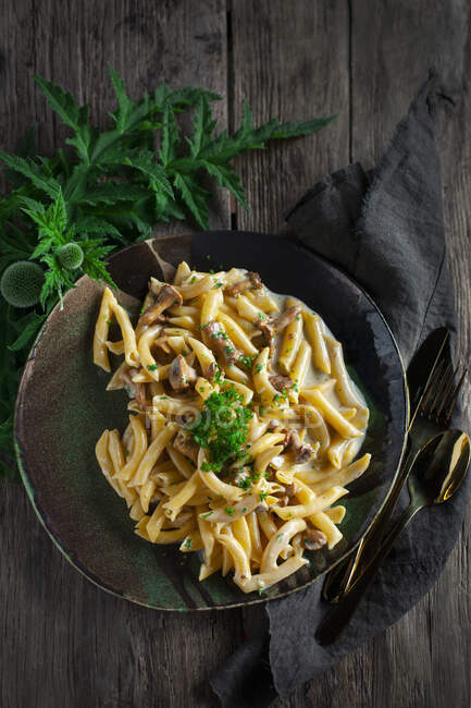 Penne pasta on dark background — Foto stock