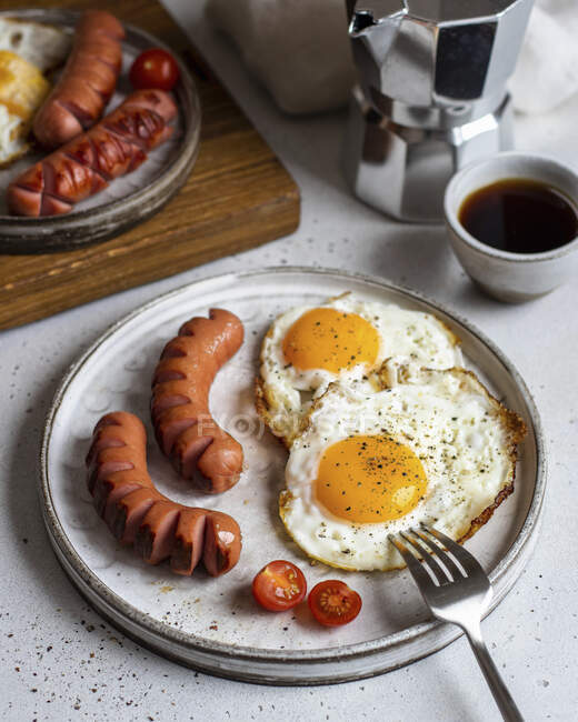 Fried eggs with sausages — Stock Photo