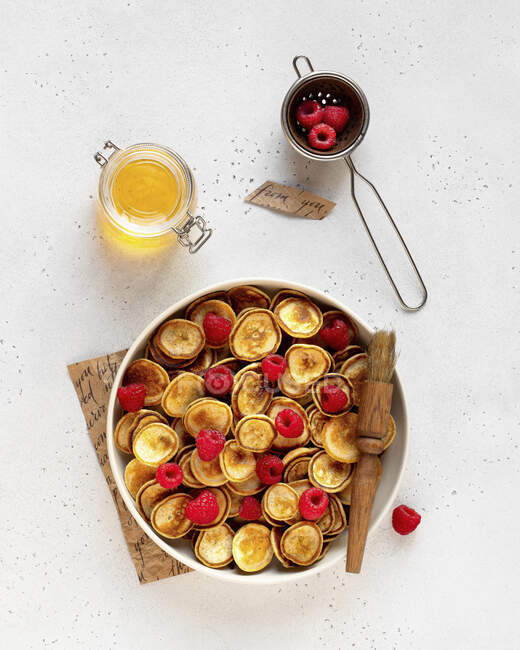 Mini pancake bowl with raspberries — Stock Photo