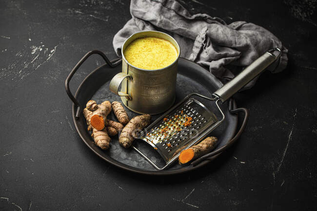 Healthy warm beverage for boosting immune system - turmeric golden milk — Stock Photo