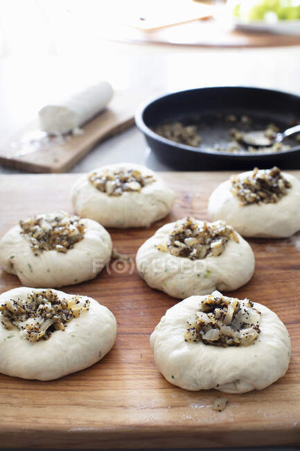 Making Bialys with Goat Cheese and Onions — Stock Photo