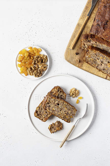 Healthy banana cake with walnuts and dried apricots — Stock Photo