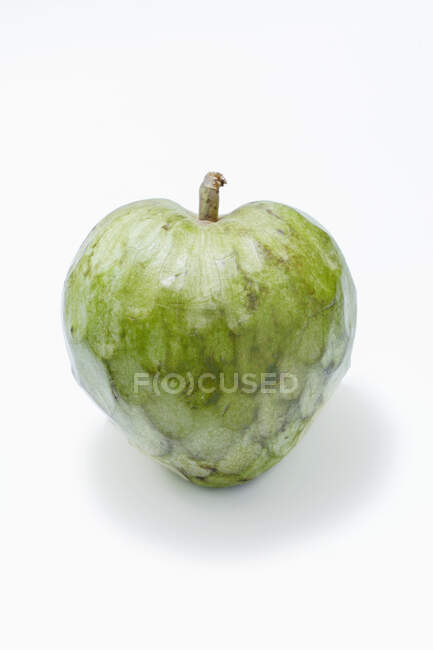 A cherimoya against a white background — Stock Photo