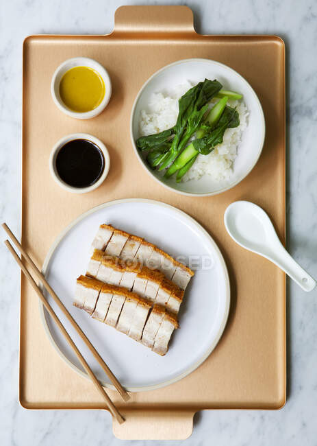Chinese pork belly with rice and vegetables on a tray — Stock Photo