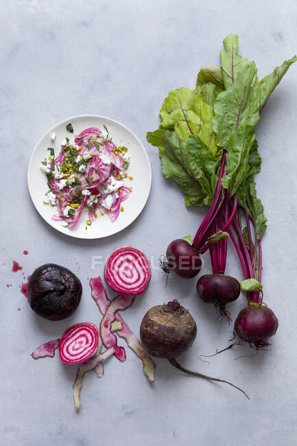 Fresh beetroot and beet salad on a gray background. top view. — Stock Photo