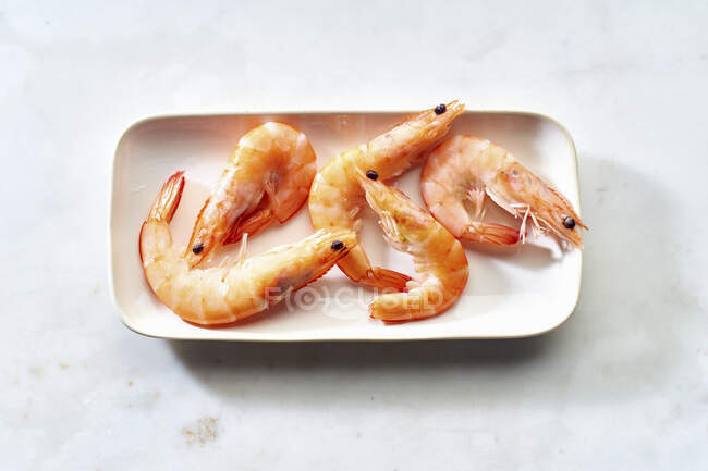 Cooked shrimps in an elongated dish — Stock Photo