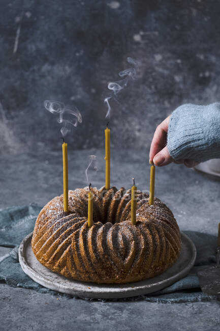 Bundt cake with candles — Stock Photo