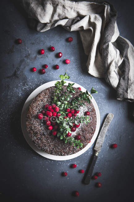 British Christmas fruitcake with knife — Stock Photo