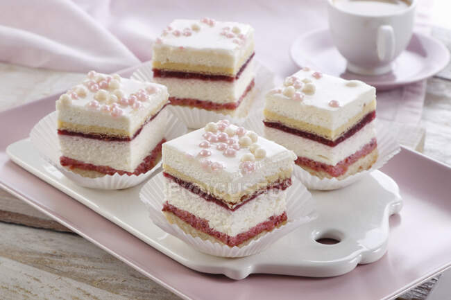 Layer cake with raspberry and cream foam — Stock Photo
