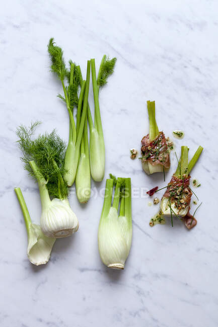 Fresh fennel bulbs and fennel with ham — Stock Photo