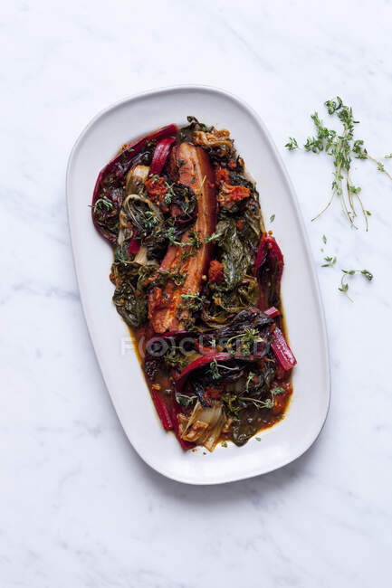 Swiss chard with bacon and tomato — Stock Photo