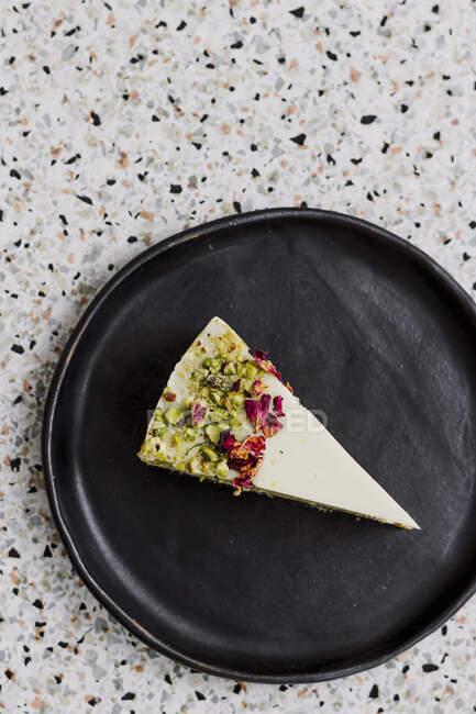 A slice of pistachio cheesecake — Stock Photo