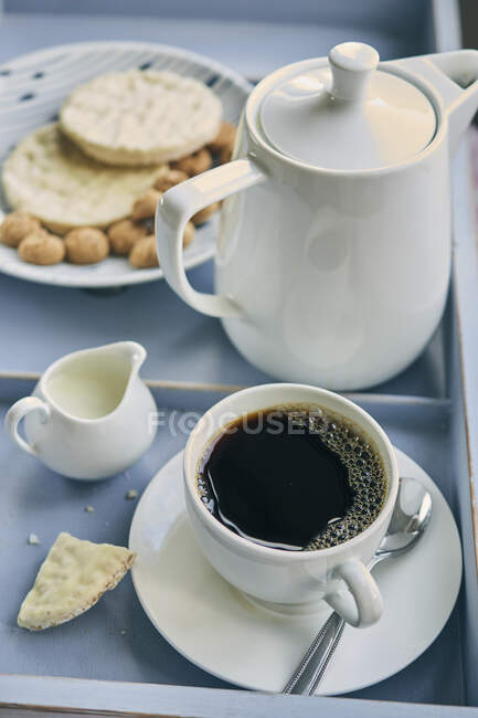 A cup of filter coffee with biscuits and pastries — Stock Photo