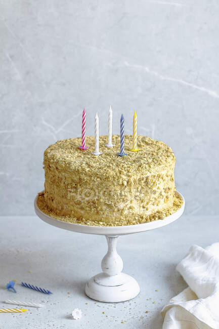 Honey cake with candles for birthday — Stock Photo