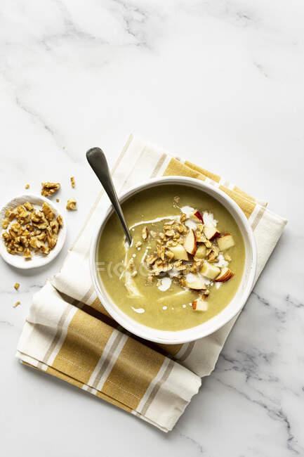 Celeriac soup with apple and walnuts — Stock Photo