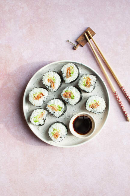 Sushi with avocado, smoked salmon and umeboshi plum — Stock Photo