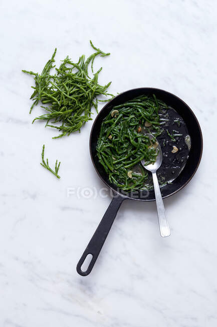 Fried samphire in a pan — Stock Photo