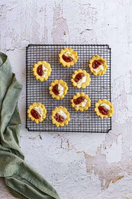 Hertzoggies - traditional South African pastry with jam and coconut topping — Stock Photo