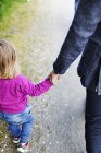 Father and daughter holding hands — Stock Photo