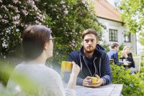 Man looking at female friend — Stock Photo