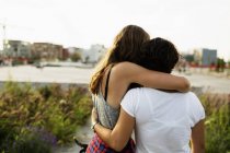 Female friends embracing at skateboard park — Stock Photo