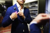 Male customer adjusting handkerchief — Stock Photo