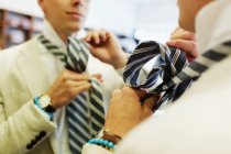 Customer tying necktie — Stock Photo