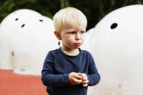 Boy looking away while pouting — Stock Photo