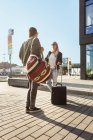 University students with luggage standing in city — Stock Photo