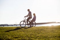 Couple riding bicycle — Stock Photo