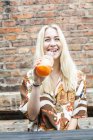 Woman drinking juice — Stock Photo