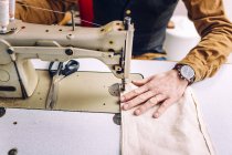 Worker sewing bag pocket — Stock Photo