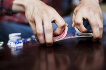 Mans hands shuffling deck of cards — Stock Photo