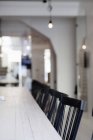 Chairs in a row at dining table — Stock Photo