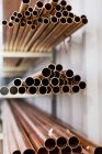 Heaps of pipes in factory — Stock Photo