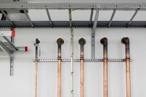 Golden pipes in factory — Stock Photo