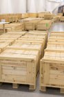 Wooden crates placed inside warehouse — Stock Photo