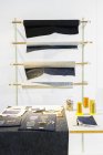 Denim fabric rolled on racks — Stock Photo