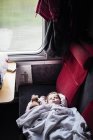 Baby sleeping in train — Stock Photo