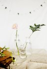 Flowers in vases on table — Stock Photo