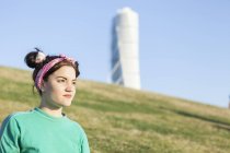 Young woman in park with Turning Torso — Stock Photo