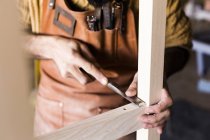 Carpenters hands using chisel in workshop — Stock Photo